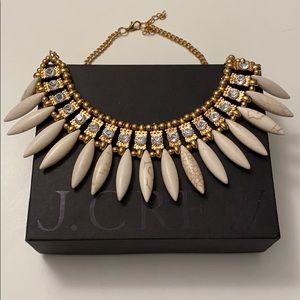 Adjustable Bib Necklace with gold tone.